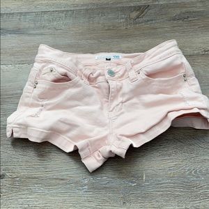 short pink shorts with rips